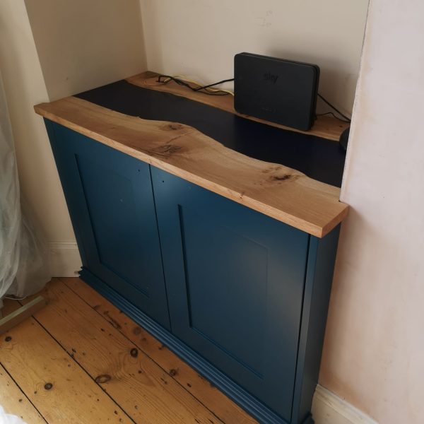 Oak epoxy river worktop on Victorian style fitted alcove cabinet.