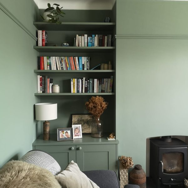 Fitted floating shelves above beaded shaker cabinet